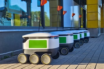 Delivery robots parking near a supermarket